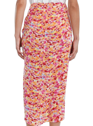 Pink Cam Sarong Style Skirt  Step into a world of endless fun with our Pink Cam Sarong Skirt! Crafted from lightweight polyester, it's your perfect summer companion. Whether you're twirling on the beach or strolling through a beachside market, the vibrant pink print will make you stand out. Back zipper and faux wrap. Embrace the joy of summer in this fabulous and versatile skirt. back