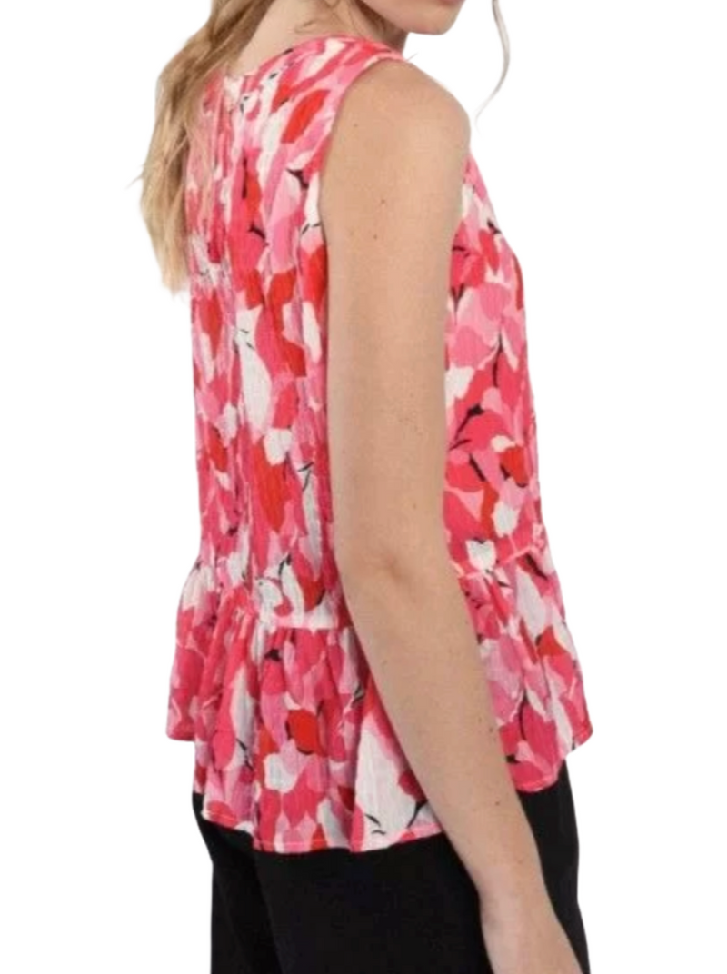 Pink Louise Sleeveless Top  Elevate your vaca style with our Pink Louise Sleeveless Top! Crafted from breezy crinkle fabric, it's the perfect choice for hot days. The playful pink print adds a pop of color to your outfit, while the sleeveless design keeps you cool. The flirty peplum hem adds a touch of flair, making it an ideal choice for both casual outings and special occasions. Embrace the sun and embrace style with this chic summer essential.  Material:  97% Polyester, 3% Elastane back