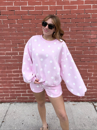 woman in Pink Polka Dot Sweatshirt
