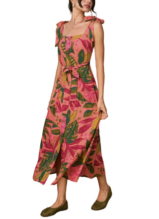 Woman wearing a pink floral dress on a white background