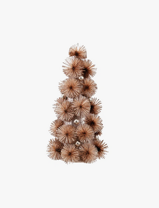 A decorative artificial Christmas tree in a conical shape, crafted from layered brown spiky pom-pom branches with a few small metallic silver ornaments, set against a plain white background.
