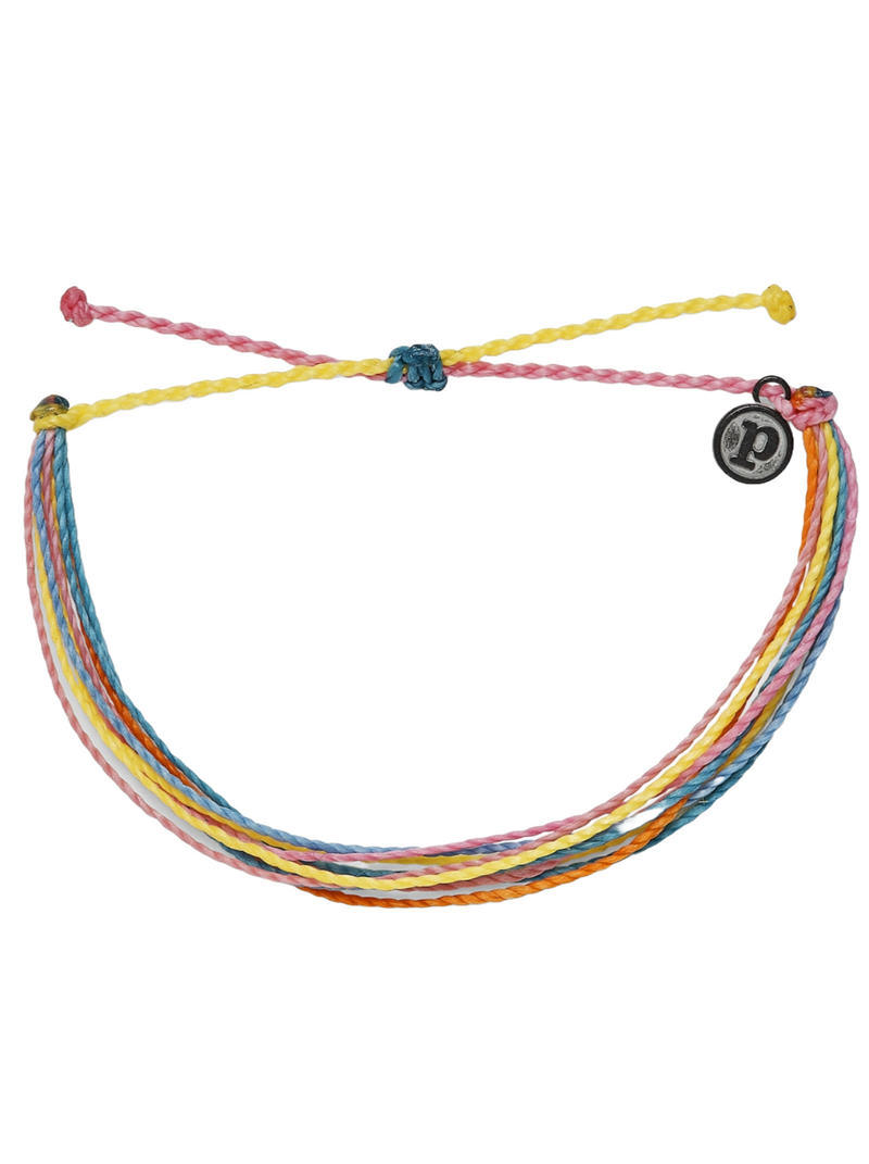 Pura Vida Bright Originals The Birthday Party Project  Need an excuse to celebrate? This bracelet is it! In a rainbow of candy-colored hues, this string style brightens up any stack. For every bracelet sold, Pura Vida will donate 5% of the purchase price to The Birthday Party Project, supporting its mission to bring joy and celebrate the lives of children experiencing homelessness through the magic of birthday parties.