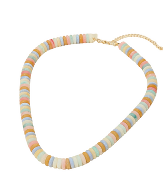 Colorful beaded necklace on a beige background