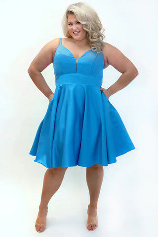 Woman wearing a blue dress on a white background