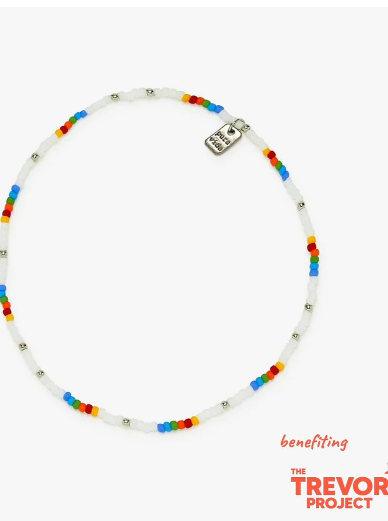 Pura Vida Rainbow Seed Bead Stretch Anklet  Flaunt your pride from head to toe with our Rainbow Seed Bead Stretch Anklet! This slip-on style features a continuous band of itty bitty seed beads, with colorful hues and sparkling silver beads sprinkled throughout. For every anklet sold, Pura Vida will donate 5% of the purchase price ($25,000 minimum) to The Trevor Project,