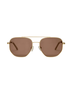 Gold-framed sunglasses with brown lenses on a light beige background