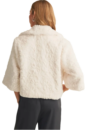 a woman wearing a Faux Fur Jacket