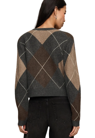 a woman wearing a Z Supply Medina Argyle Cardigan