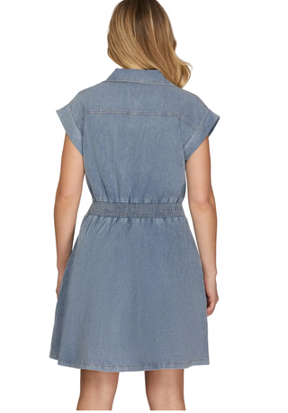 a woman wearing a Light Blue Denim Mini Dress with a front zipper
