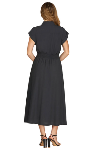 a woman wearing Smocked Waist Midi Dress Charcoal Navy