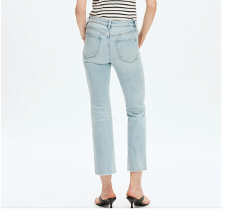 a woman wearing Mid Rise Cropped Stepped Hem Bootcut Jeans