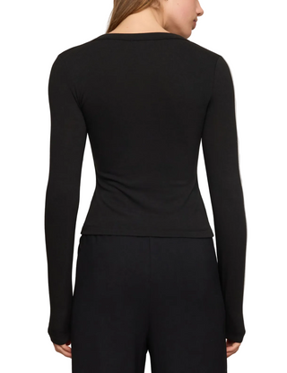 a woman wearing a Z Supply  In Flow Henley Top - Black
