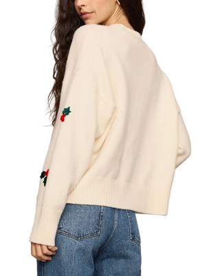 a woman wearing a Z Supply Holly Berry Sweater