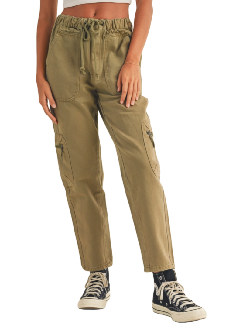 Seaside Safari Cargo Pants  Olive green washed cargo pants are a fantastic choice for a laid-back beach vacation. You can wear them for a sunset beach bonfire, casual seaside dinners, or exploring local markets and boardwalks. Their comfortable and versatile style makes them perfect for strolling along the shore, and the earthy color complements the coastal vibes beautifully.   Material:  90% Cotton, 10% Polyester