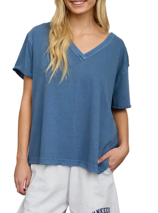 woman wearing a v neck blue tee
