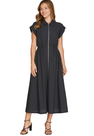 a woman wearing a Smocked Waist Midi Dress Charcoal Navy