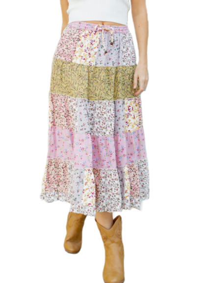 Summer Cottage Mid Length Skirt  Mid length tiered skirt with patchwork look, lined, and elastic waist with drawstrings in a variety of pastel rayon prints.  Material:  Rayon