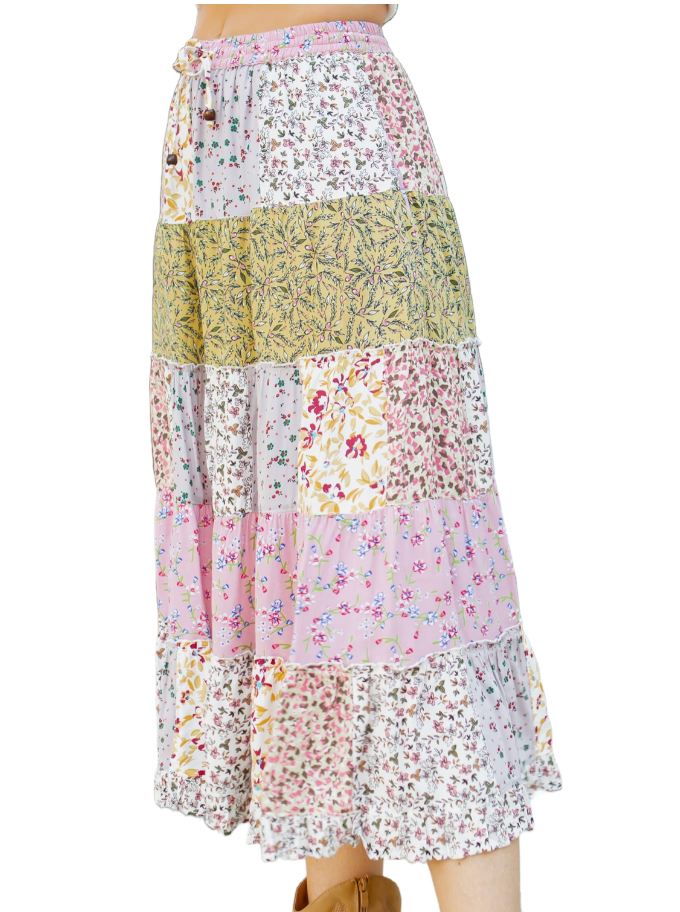 Summer Cottage Mid Length Skirt  Mid length tiered skirt with patchwork look, lined, and elastic waist with drawstrings in a variety of pastel rayon prints.  Material:  Rayon Side view