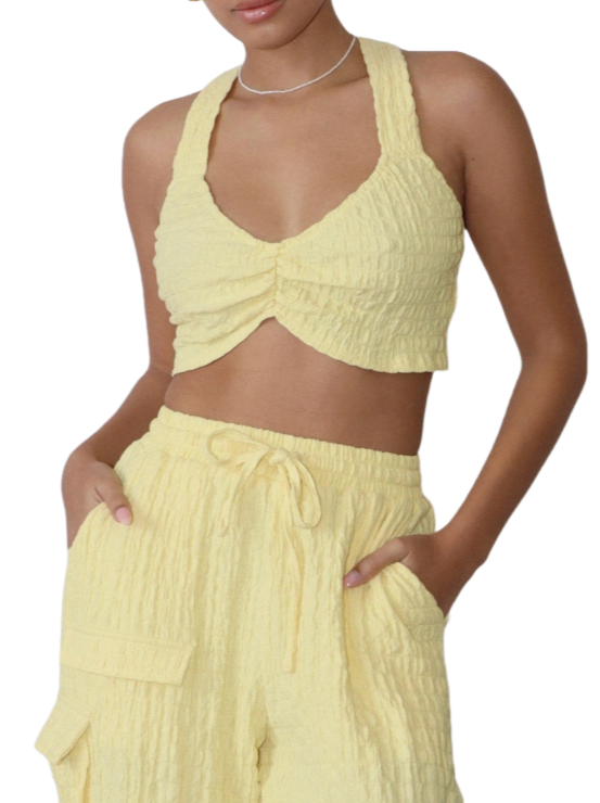 Sunshine Adventure Crop Top  Amidst an autumn day, don this crinkle knit crop top, setting the fashion stage. With criss-cross straps adding flair, you're a trendsetter on display, A vibrant burst of sunshine in the midst of the fall's elegant array.   Material: 100% Polyester