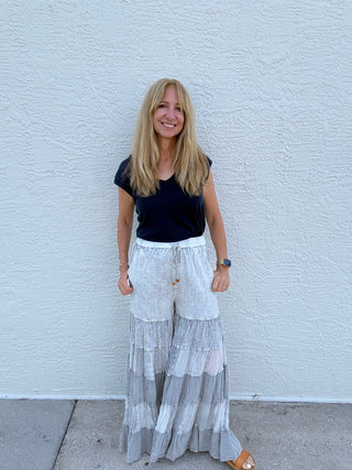 woman in gray tiered embroidered pants