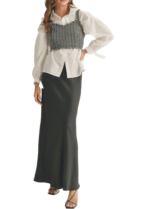 A white collared top paired with a black and white tweed vest creates an elegant and refined outfit that blends classic elements with contemporary style. It's a two piece fashion-forward choice that exudes sophistication and versatility. (items can be worn separately)