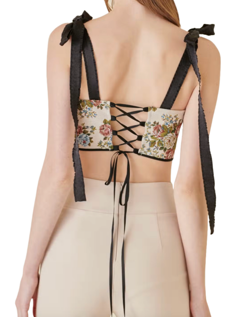 Victorian Charm Corset Top  Delicately draped ruffled bow tie shoulder straps add a touch of whimsy to a square neckline, while the curved lower midriff sculpts a flattering silhouette. Enchant in a vintage retro floral print, cinched together with a graceful lace-up back, blending timeless charm with contemporary allure. back