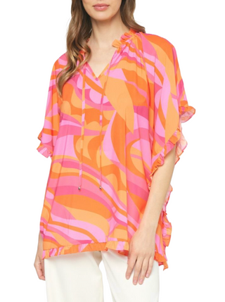 Warm Smile Top  Printed v-neck ruffle sleeve poncho style top featuring self tie at front neck. Unlined. Woven. Non-sheer. Lightweight.  Material: 100% Polyester