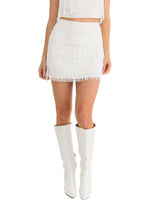 White Fancy Fringe Skirt is a fringe satin mini skirt with a side zipper.  97% Polyester     3% Spandex