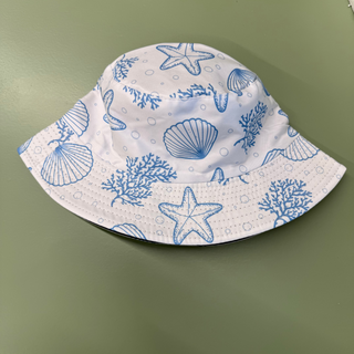 Adult bucket hat with blue sea-themed pattern on a white backgroun