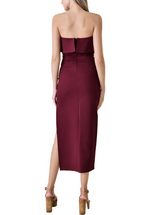 Wearing this dress, you'll exude confidence and allure, in its striking merlot color combined with the leg slit and upper ruffle detail will make you the center of attention wherever you go. It's a perfect choice for those who want to make a stylish statement with a hint of sensuality.(back)