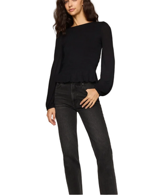 a woman wearing a Z Supply Black Carey Smocked Peplum Top