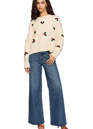 a woman wearing a Z Supply Holly Berry Sweater in the color sandstone
