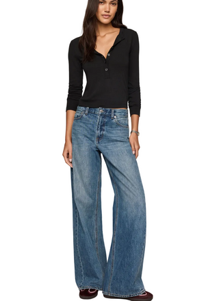 a woman wearing Z Supply  In Flow Henley Top in black