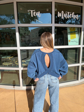 blue crewneck sweatshirt with cutout back back