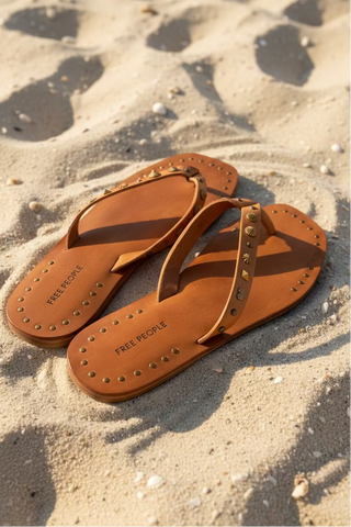 free people brown leather sandals inthe sand