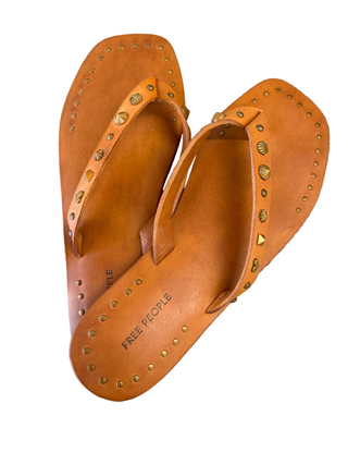 free people brown leather sandals with shell detail and other metal brass details on strap