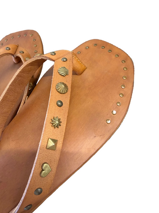 free people leather flip flops with shell and other metal detail