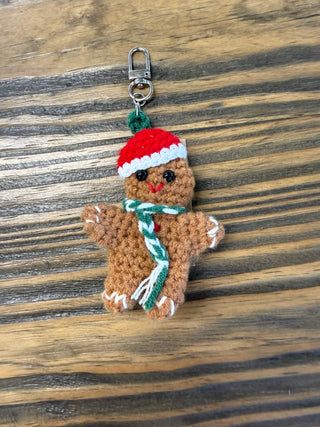 crochet ginger bread key chain witha. red santa hat on