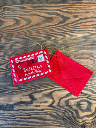 red felt envelope that is a letter tosanta.  hangs forma. dree and you can put a ltter int he back