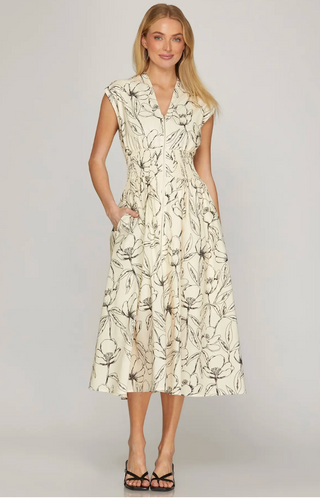 cream and black floral midi dress.
