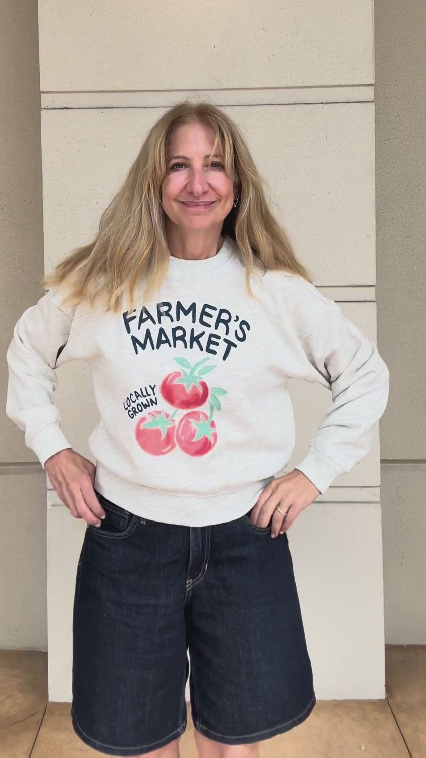trying on details of the farmers market sweatshirt
