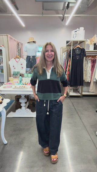 woman in video talking about how the denim easy peasy pants fit.  They run a little large but they have elastic waist and a drawstring pant so can fit many sizes