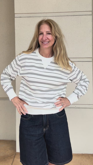 try on video for a striped crewneck sweatshirt
