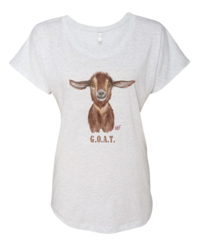 Light heather grey tee with a goat painted on it and G.O.A.T. beneath the image.