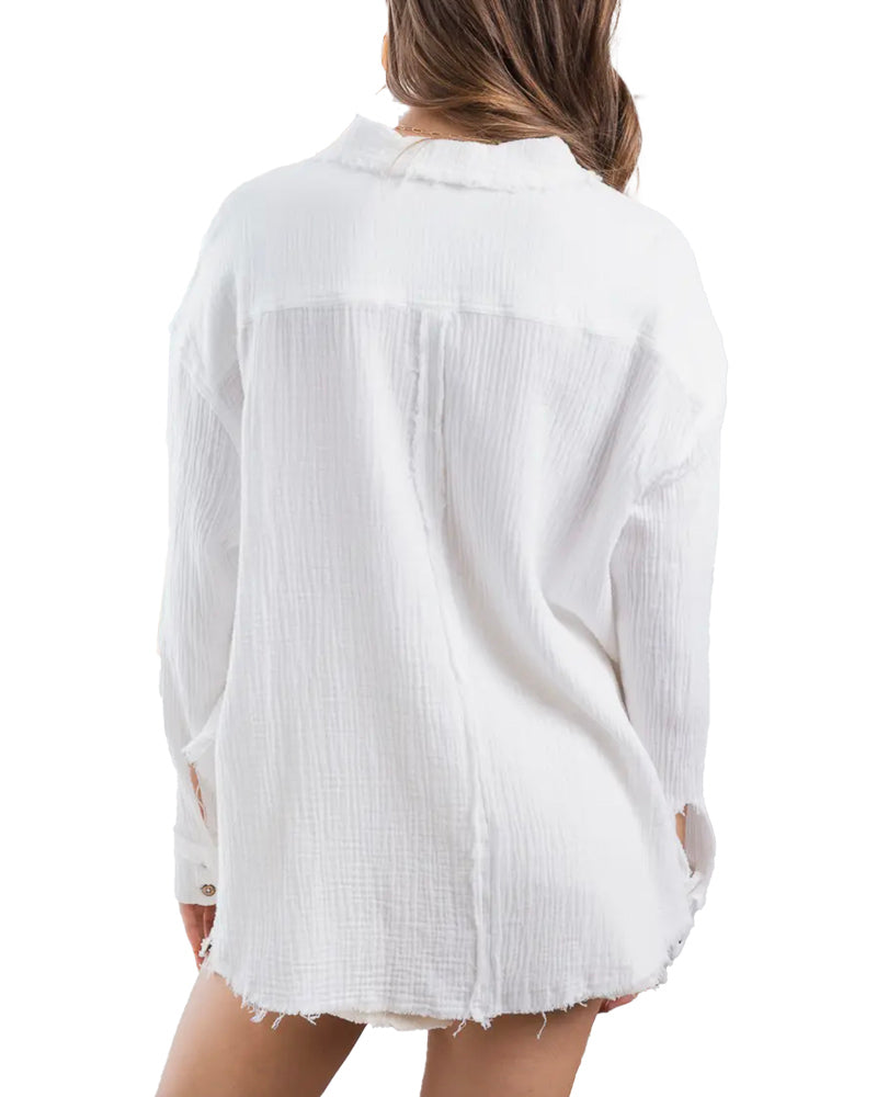 Blythe Button Down Gauze Top  Button down shirt with wood-tone buttons and back placket detail.  100% Cotton Back