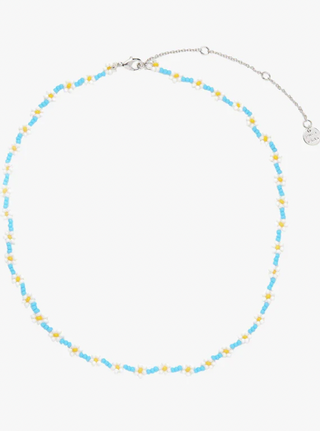 Let your jewelry collection bloom with our Daisy Seed Bead Choker. This bold and whimsical style serves some major flower power.Brass Base with Rhodium Plating & Seed Beads - 14" with 3" Extension - Flower Dimensions: 6.4mm Diameter