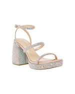 Denni Rhinestone Sandal  The Denni embellished chunky platform heel is the ultimate statement heel to wear to any event. Its delicate straps make it simple yet sweet. Satin Rhinestone heels Synthetic lining Betsey Blue sole 3.75 inch heel height Imported Brand: Betsey Johnson 