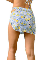 Erin Mini Skirt  The Erin mini skirt is your new best friend at the beach. Designed with a high leg slit and a lettuce trim detail, this slip-on is an easy, breezy cover up.  Material: 80% Nylon / 20% Spandex  
