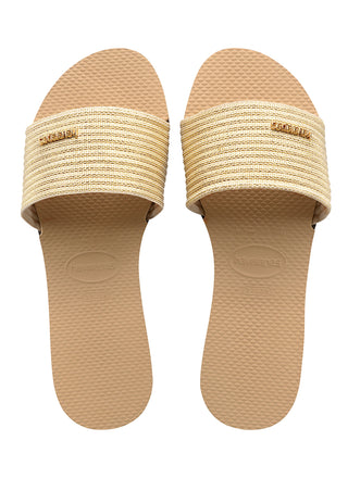 Havaianas You Malta Metallic Sandal in Golden  Who said you can’t dress up a Slide? If you like the idea of a slide with a bit of an elevated twist, the You Malta Metallic is for you! These sandals for women combine comfort and style in one – the large strap across the center features metallic details for a feminine look that you can step right into.