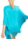 Lailah Swim Cover-Up in Turquoise  In a flowy silhouette, this jersey knit cover-up has dolman-like sleeves and fringe running along the hem. So easy to slip on over your swimwear and versatile enough to wear out and about.  Material: 100% Rayon back